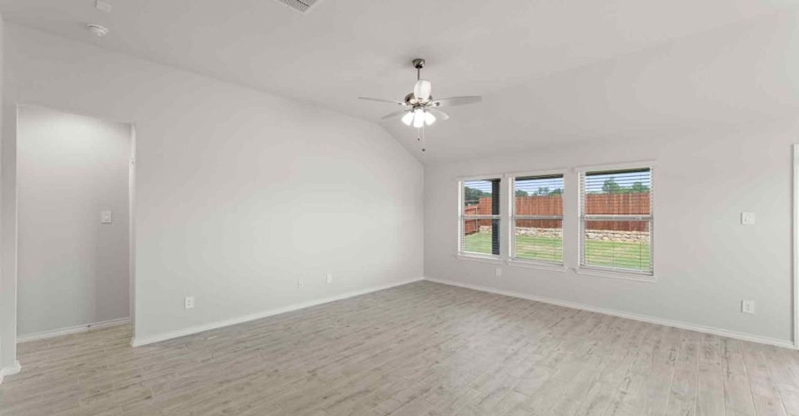 Representative exterior photo of a completed home built from the Atlanta by Impression Homes in Keeneland, Aubrey, TX (Image 10).