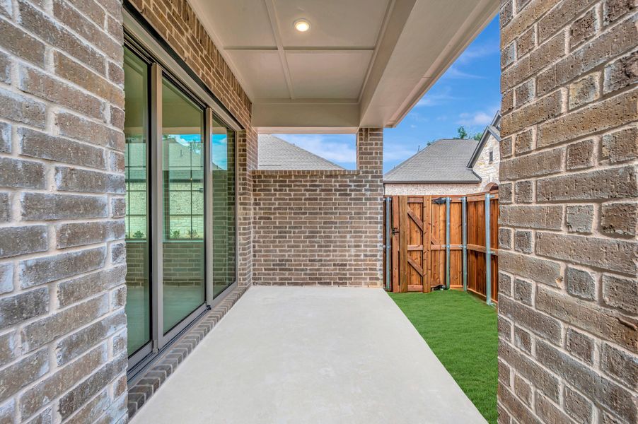 Exterior details and patio area of a home in Elements at Viridian - Garden Series, Arlington (Image 4). Exterior details and patio area of a home in Elements at Viridian - Garden Series, Arlington (Image 4).