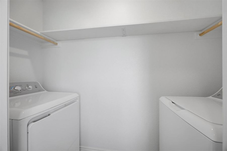 Functional utility space includes built-in shelving overhead.