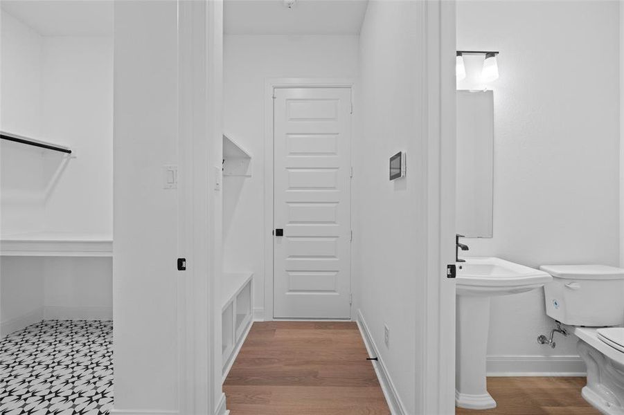 Bathroom featuring hardwood / wood-style floors and toilet