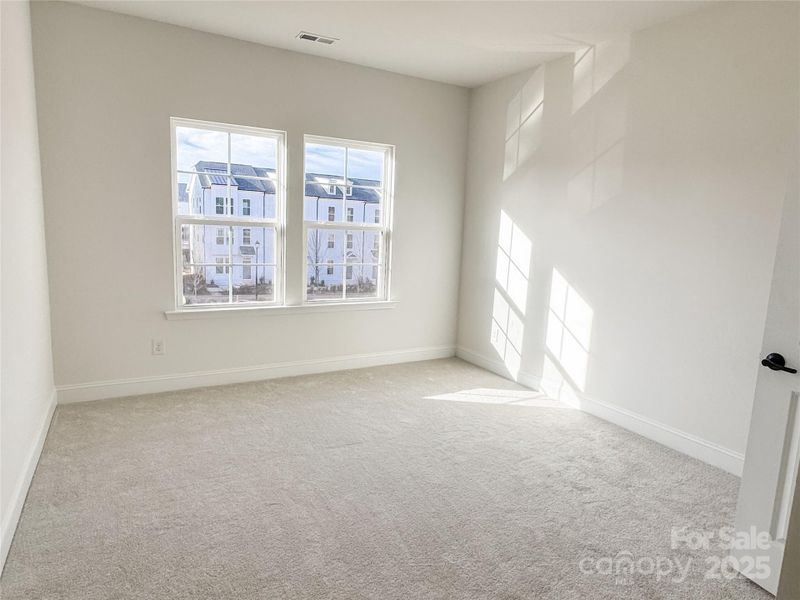 Spacious, unfurnished interior of a new home in The River District Townhomes, Charlotte (Image 18).