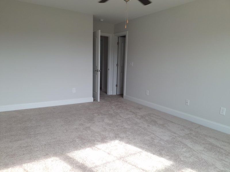 Spacious, unfurnished interior of a new home in Weybridge, Burlington (Image 68).