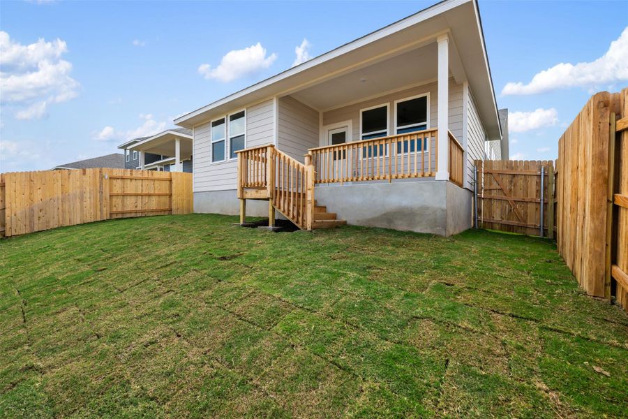 Exterior details and patio area of a home in Cannon Ranch 40s, Dripping Springs (Image 13).