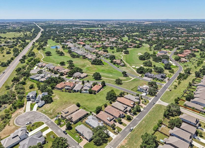 Front exterior of a new home in Cimarron Hills – Villas & Country Club, Georgetown, TX, highlighting curb appeal (Image 26).