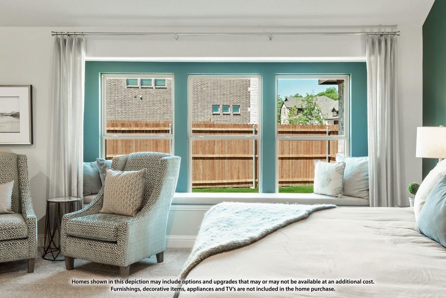Bedroom with teal accent wall, triple windows with window seat, and sitting area with upholstered chairs Bedroom with teal accent wall, triple windows with window seat, and sitting area with upholstered chairs