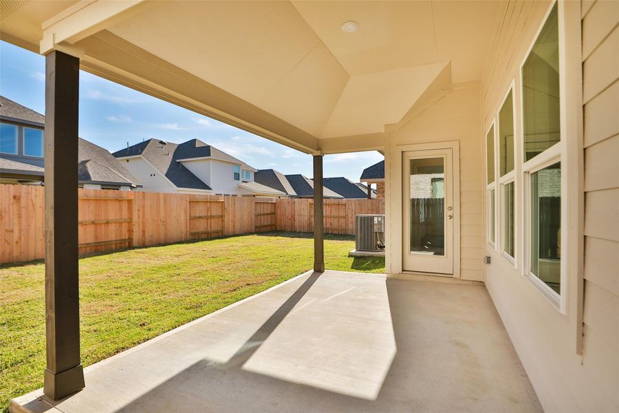 Exterior details and patio area of a home in Beamer Villas, Friendswood (Image 3).
