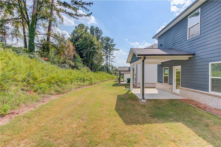 Front exterior of a new home in Sweetwater Green - Royal Series, Lawrenceville, GA, highlighting curb appeal (Image 2).