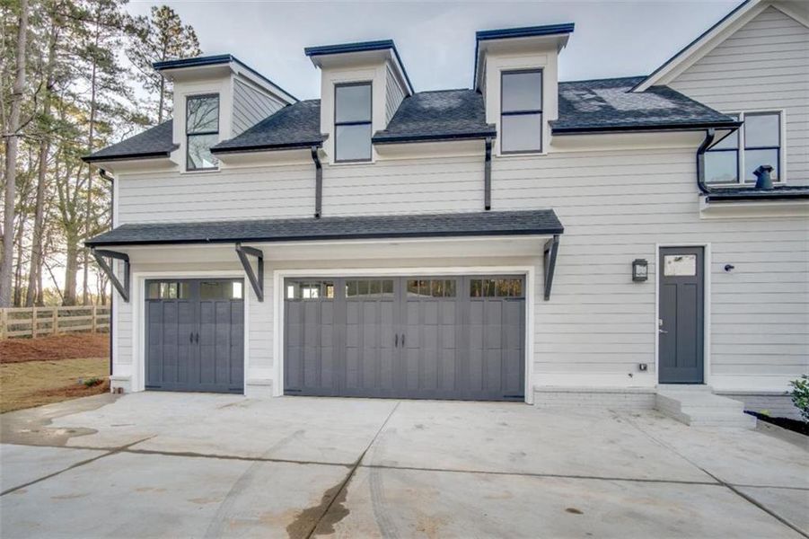 Front exterior of a new home in , Woodstock, GA, highlighting curb appeal (Image 29).