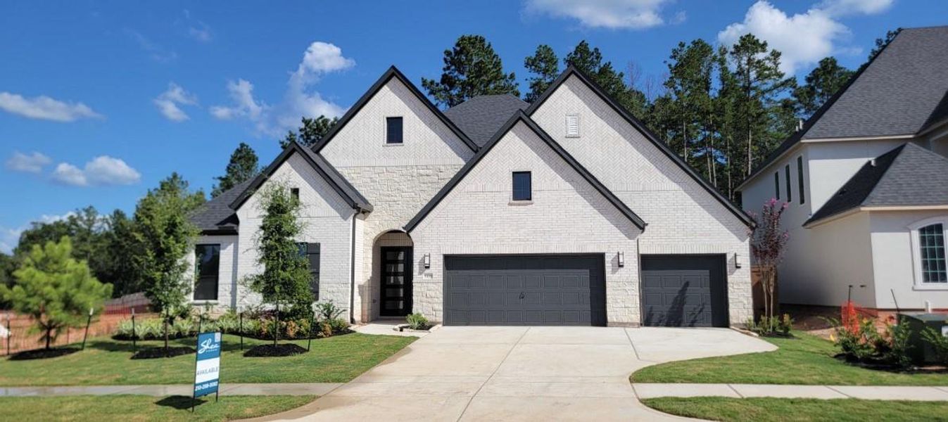 Front exterior of a new home in WILDTREE 70', Montgomery, TX, highlighting curb appeal (Image 2). Front exterior of a new home in WILDTREE 70', Montgomery, TX, highlighting curb appeal (Image 2).
