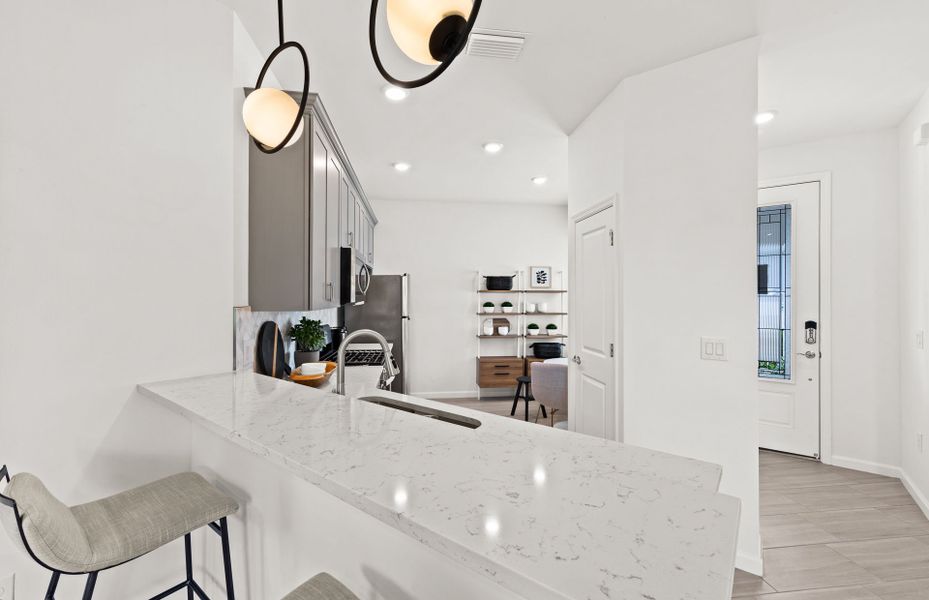 Representative furnished interior of a home built from the Cascadia by DiVosta in BeachWalk by Manasota Key, Englewood (Image 6).