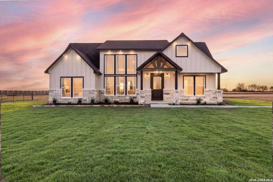 Front exterior of a new home in , Natalia, TX, highlighting curb appeal (Image 23).