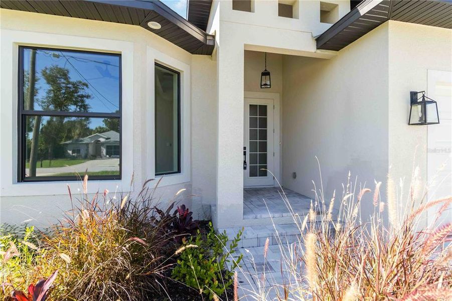 Front exterior of a new home in , Rotonda West, FL, highlighting curb appeal (Image 20).