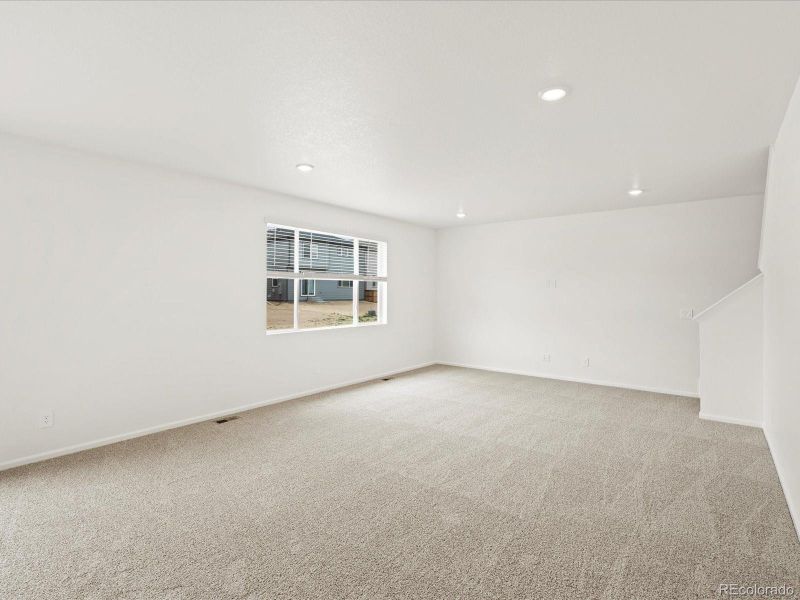 Spacious, unfurnished interior of a new home in Ridgeline Vista: The Flora Collection, Brighton (Image 18).