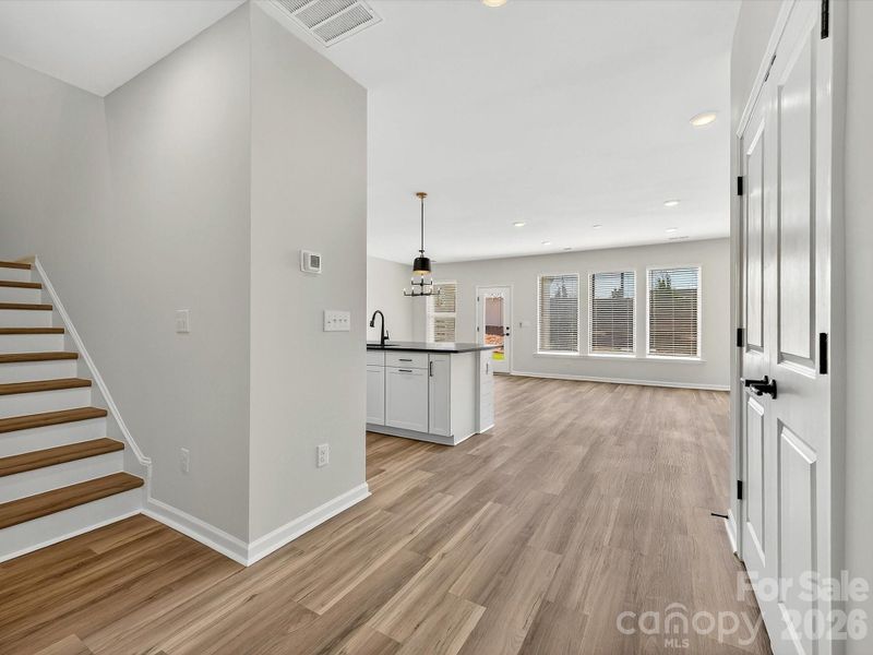LVP throughout the main floor with LVP cmposite stair treads