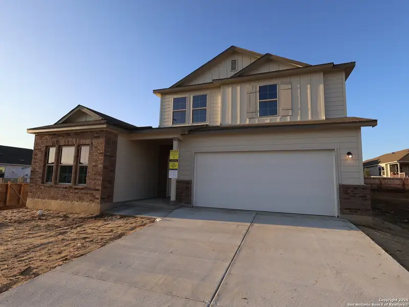 Front exterior of a new home in Greenspoint Heights, Seguin, TX, highlighting curb appeal (Image 1).