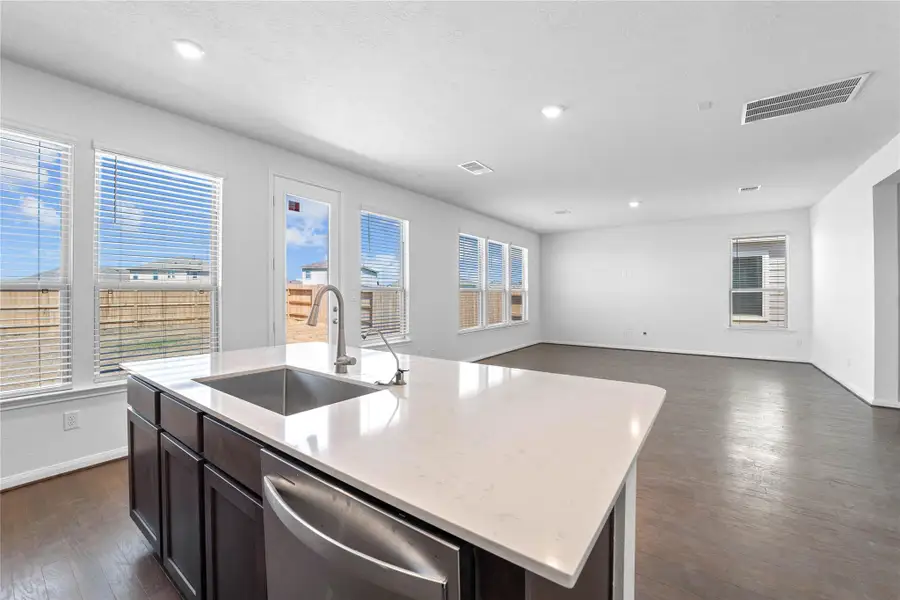 This spacious kitchen has it all—ample storage, generous counter space, and a layout that truly makes it the heart of the home.