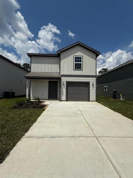 Front exterior of a new home in Townsend Reserve, Splendora, TX, highlighting curb appeal (Image 1). Front exterior of a new home in Townsend Reserve, Splendora, TX, highlighting curb appeal (Image 1).