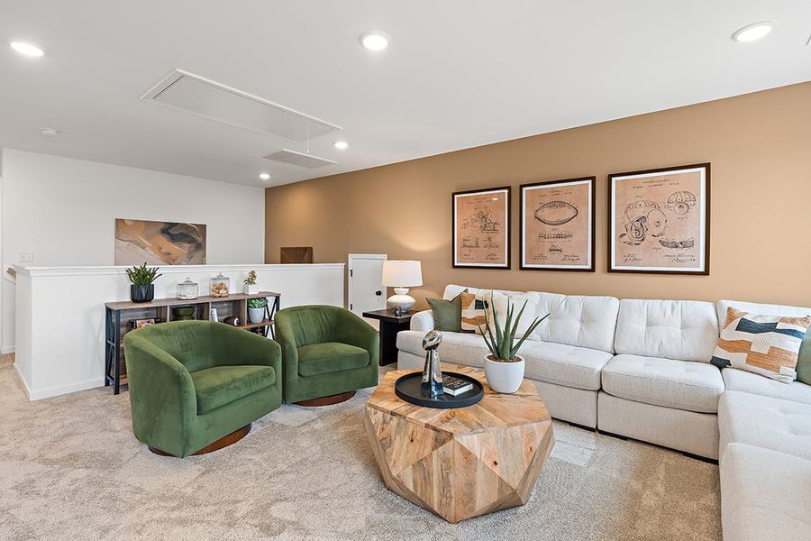 A living room with green couches. A living room with green couches.