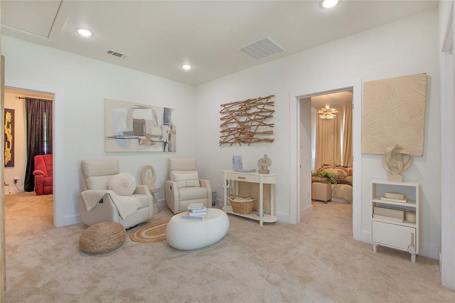 Living area featuring light colored carpet and recessed lighting Living area featuring light colored carpet and recessed lighting