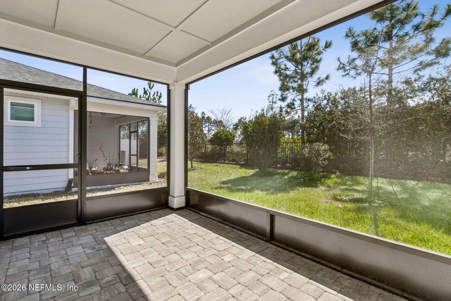 Exterior details and patio area of a home in Del Webb Wildlight, Wildlight (Image 25).