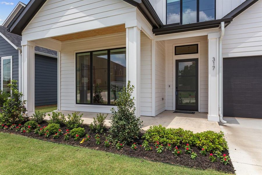 Entryway with Covered front porch. Freshly landscaped! Entryway with Covered front porch. Freshly landscaped!