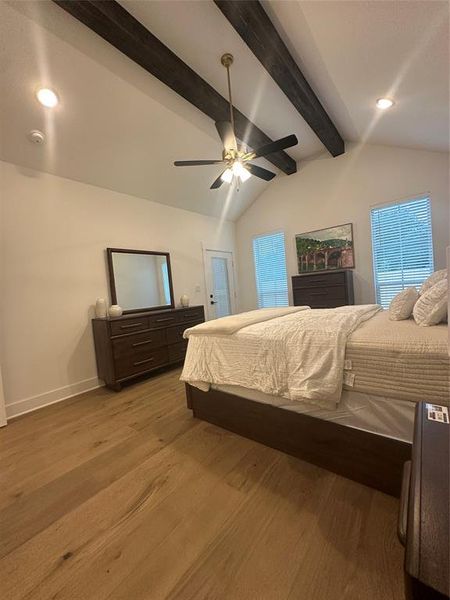 Vaulted ceiling featuring exposed beams and recessed lighting