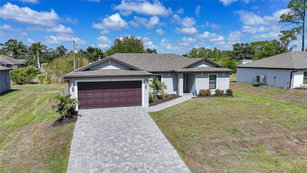 Front exterior of a new home in , Port Charlotte, FL, highlighting curb appeal (Image 31).