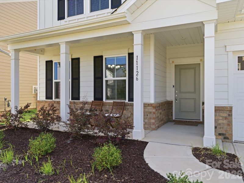 Exterior details and patio area of a home in Parkside Crossing, Charlotte (Image 26). Exterior details and patio area of a home in Parkside Crossing, Charlotte (Image 26).
