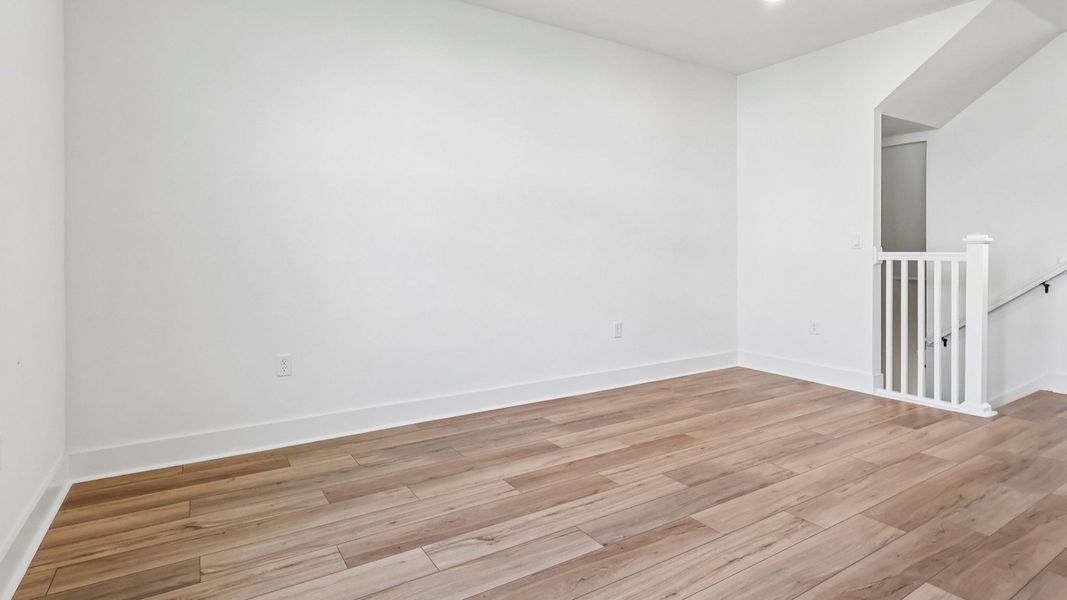 Furnished interior view inside a new home in Parkview at Hamlin, Winter Garden (Image 9).