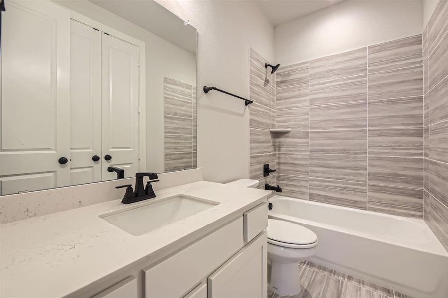 Bathroom with vanity and bathtub / shower combination Bathroom with vanity and bathtub / shower combination