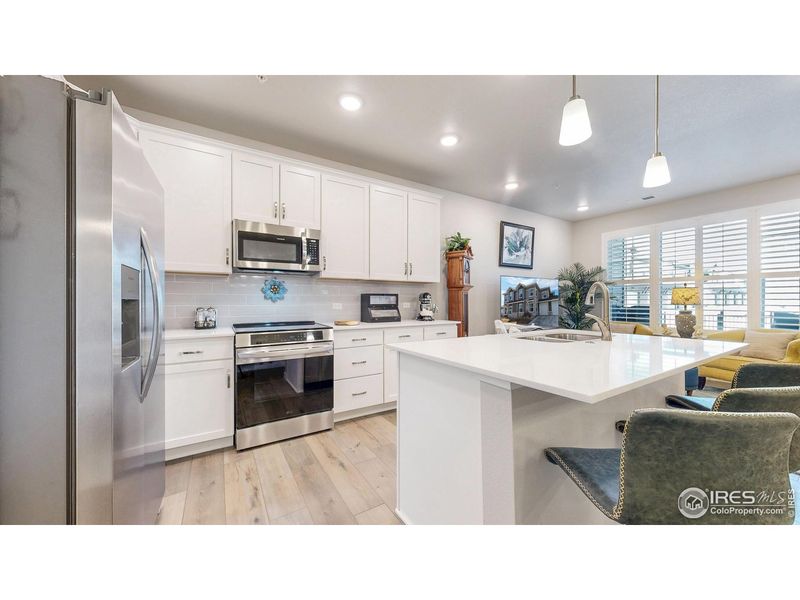 Furnished interior view inside a new home in The Lakes at Centerra - Discovery, Loveland (Image 10).