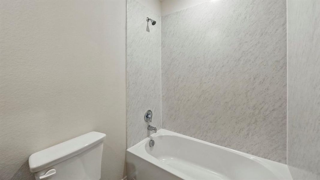 Bathroom with toilet and washtub / shower combination