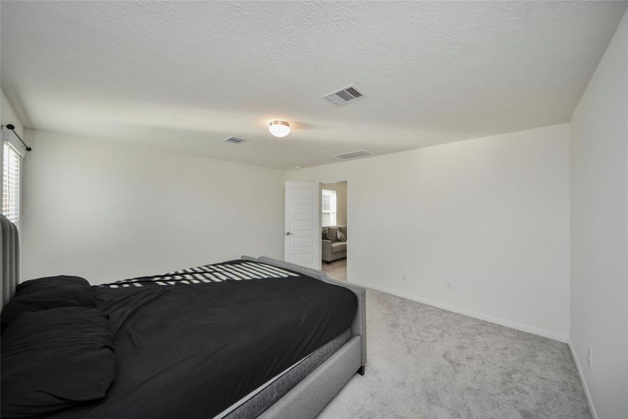 Furnished interior view inside a new home in Sunterra North, Katy (Image 9).