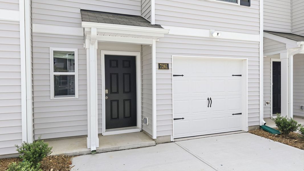 Exterior details and patio area of a home in The Townes at Hunter Hill, Rocky Mount (Image 3).