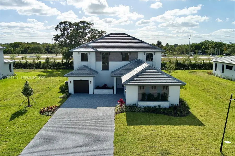 Front view including 2 single car garage Front view including 2 single car garage
