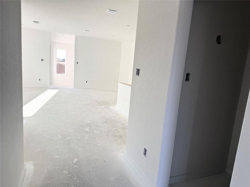 Unfurnished room featuring baseboards and concrete floors Unfurnished room featuring baseboards and concrete floors