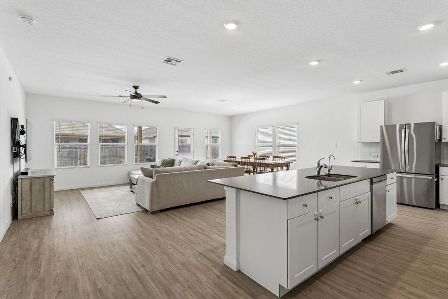 An open-concept living space with a contemporary kitchen island and generous natural light.