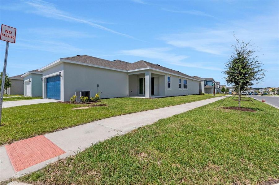 Front exterior of a new home in Crossroads at Kelly Park, Apopka, FL, highlighting curb appeal (Image 31).
