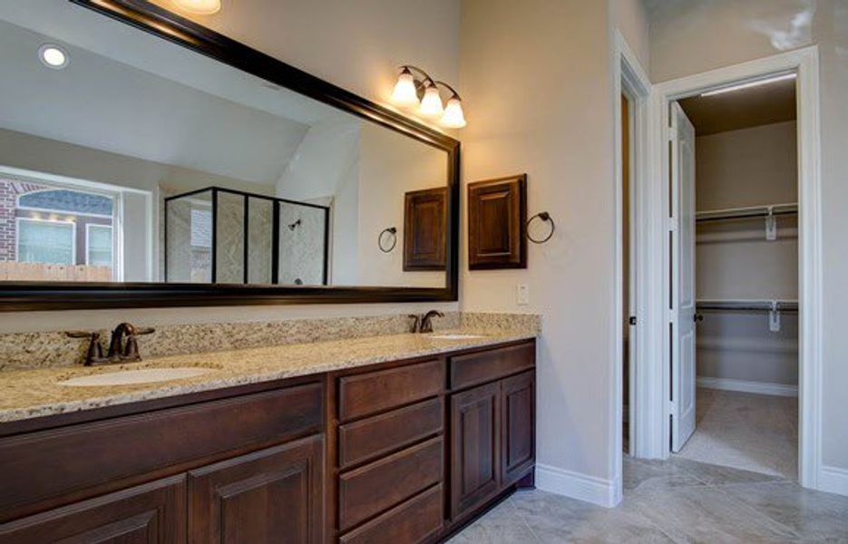 Representative furnished interior of a home built from the 3326 by Ravenna Homes in The Woodlands Hills 65′, Willis (Image 9).