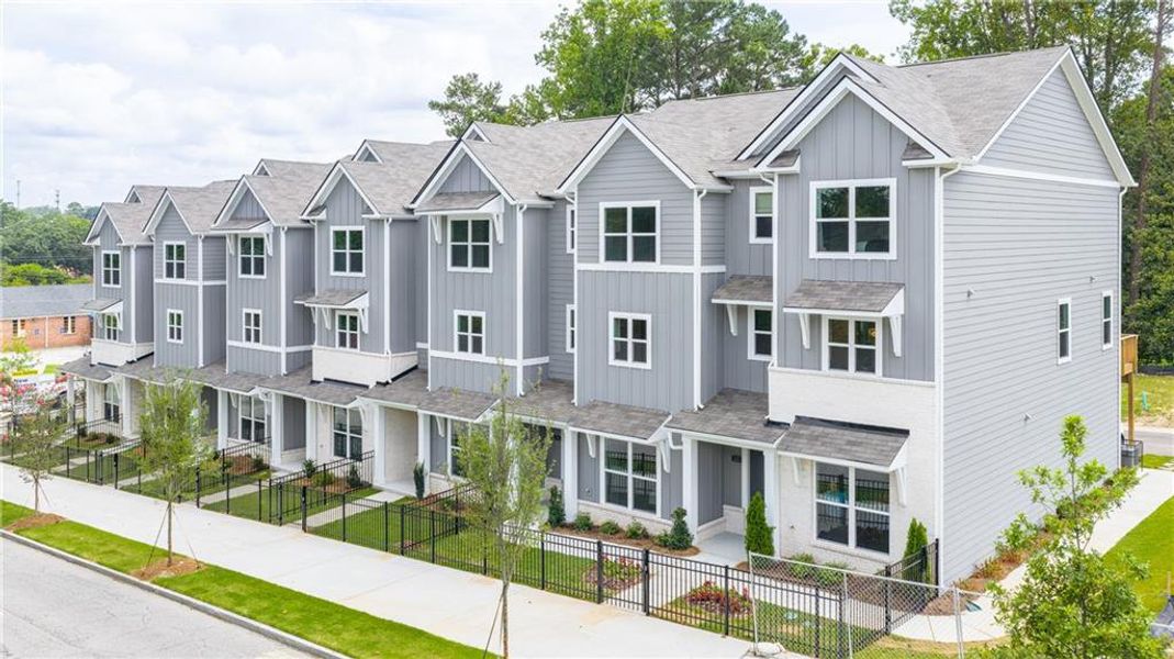 Front exterior of a new home in Towns at Monroe, Atlanta, GA, highlighting curb appeal (Image 1).