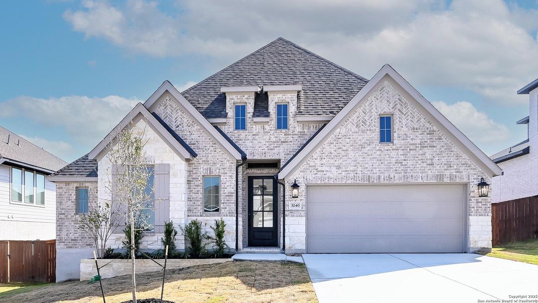 Front exterior of a new home in Homestead 65', Schertz, TX, highlighting curb appeal (Image 19).
