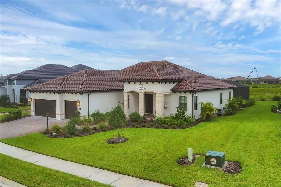 Front exterior of a new home in , Englewood, FL, highlighting curb appeal (Image 26).
