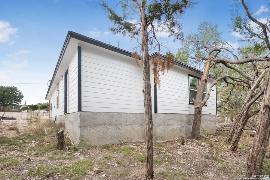 Exterior details and patio area of a home in , Spring Branch (Image 2). Exterior details and patio area of a home in , Spring Branch (Image 2).