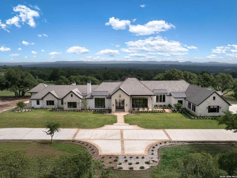 Front exterior of a new home in , Boerne, TX, highlighting curb appeal (Image 24).