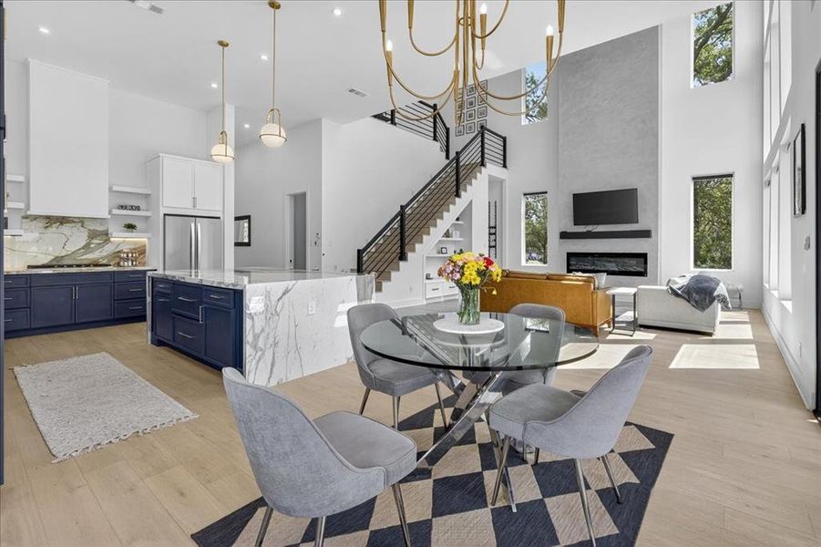Open dining space seamlessly connected to the kitchen and living room