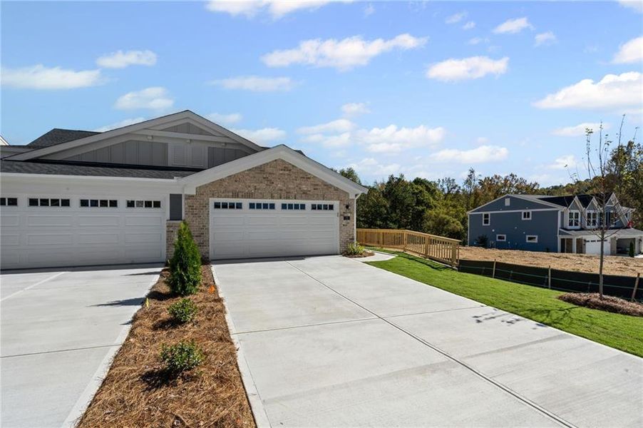Front exterior of a new home in Villas at Gold Creek, Dawsonville, GA, highlighting curb appeal (Image 23). Front exterior of a new home in Villas at Gold Creek, Dawsonville, GA, highlighting curb appeal (Image 23).