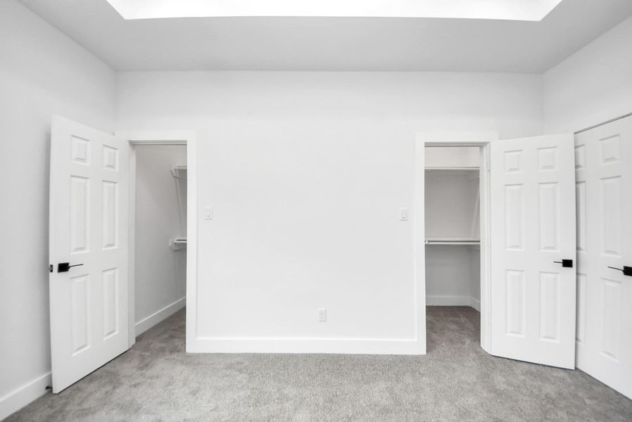 Primary walk-in closet. Primary walk-in closet.