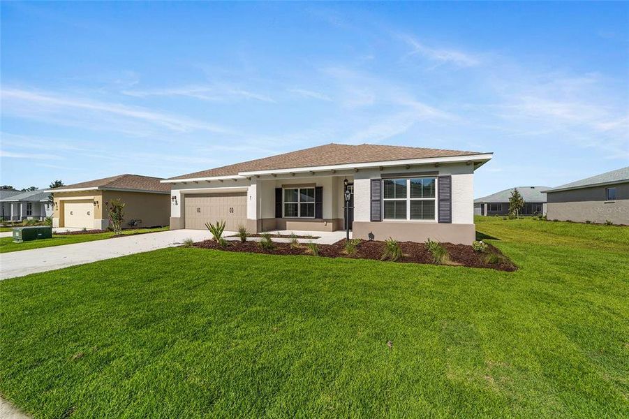 Front exterior of a new home in On Top of the World Communities, Ocala, FL, highlighting curb appeal (Image 17).