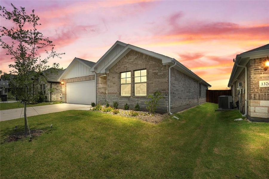 Ranch-style house featuring driveway, an attached garage, and board and batten siding Ranch-style house featuring driveway, an attached garage, and board and batten siding