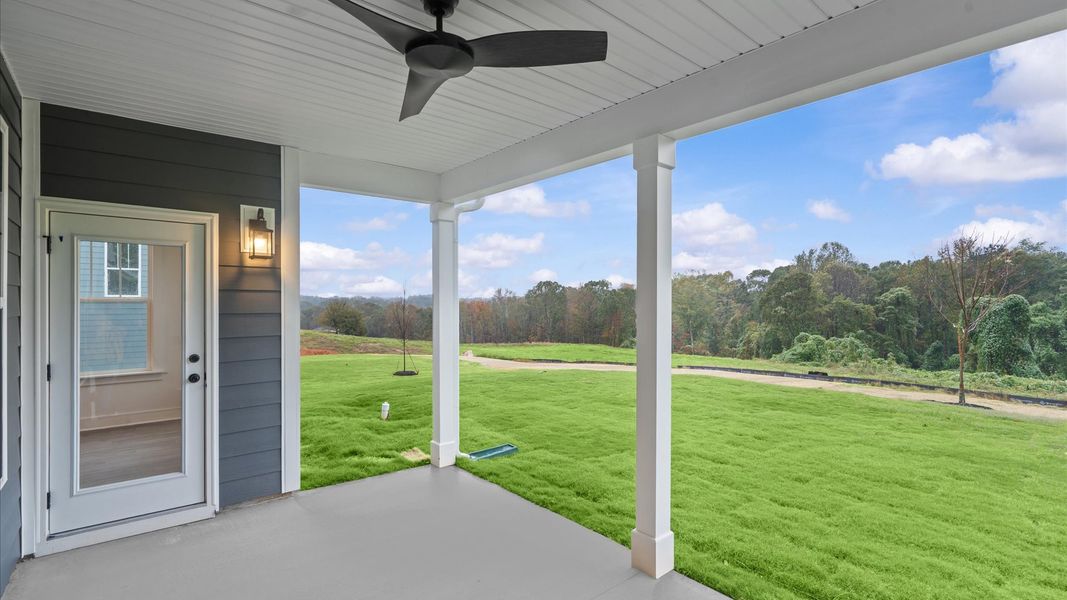 Notable exterior includes a rear covered porch designed for year-round enjoyment